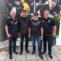 New Zealand fans (from left) Paul Bright, Errol Hussey, Brian King and Mike Green pose for a photo outside Yokohama\'s Nissan Stadium before the All Blacks\' Bledisloe Cup game against Australia on Saturday. | ANDREW MCKIRDY