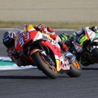 Repsol Honda\'s Marc Marquez (left) and LCR Honda\'s Cal Crutchlow turn during the MotoGP in Motegi,Tochigi Prefecture. | REUTERS