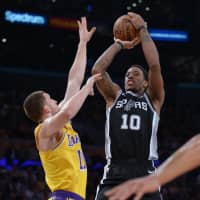 San Antonio\'s DeMar DeRozan shoots over Los Angeles\' Sviatoslav Mykhailiuk on Monday night. | USA TODAY / VIA REUTERS