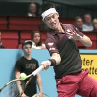 Kei Nishikori returns a ball against Mikhail Kukushkin on Saturday in the semifinals of the Erste Bank Open in Vienna. | KYODO
