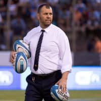 Australia head coach Michael Cheika walks on the field before an Aug. 6 match against Argentina in Salta, Argentina. | REUTERS