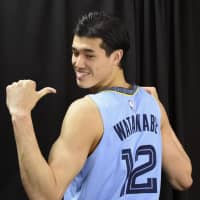 Yuta Watanabe poses in his Grizzlies jersey last month in Memphis, Tennessee. | KYODO