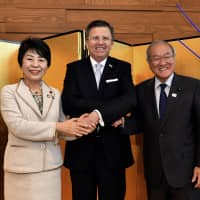 Chilean Ambassador Gustavo Ayares (center) poses for a photo with Justice Minister Yoko Kamikawa (left) and the minister in charge of the Tokyo Olympic and Paralympic Games, Shunichi Suzuki, during a reception to celebrate Chile\'s independence day on Sept. 21. | YOSHIAKI MIURA