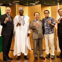 Nigerian Ambassador Mohammed Gana Yisa (second from left) with, from left, Parliamentary Vice-Minister for Foreign Affairs Manabu Horii, Member of House of Representatives Kazunori Tanaka, Member of House of Councilors Kiyoshi Ejima and Member of House of Representatives Hiroyuki Miyazawa during a reception to celebrate of the 58th anniversary of the independence of the Federal Republic of Nigeria at Hotel New Otani on Oct. 1. | YOSHIAKI MIURA