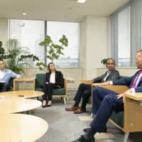 From left: Tomonori Ito, executive MBA program director of Hitotsubashi University; Naheel Wafa Dajany from Germany, director of corporate communications at All Nippon Airways Co.; Jayathura Samarakoon from Sri Lanka, manager of digital services, solution areas at Ericsson Japan K.K.; and Cameron Brett from Canada, managing director of the professional division at Randstad Japan K.K. | MASANORI DOI