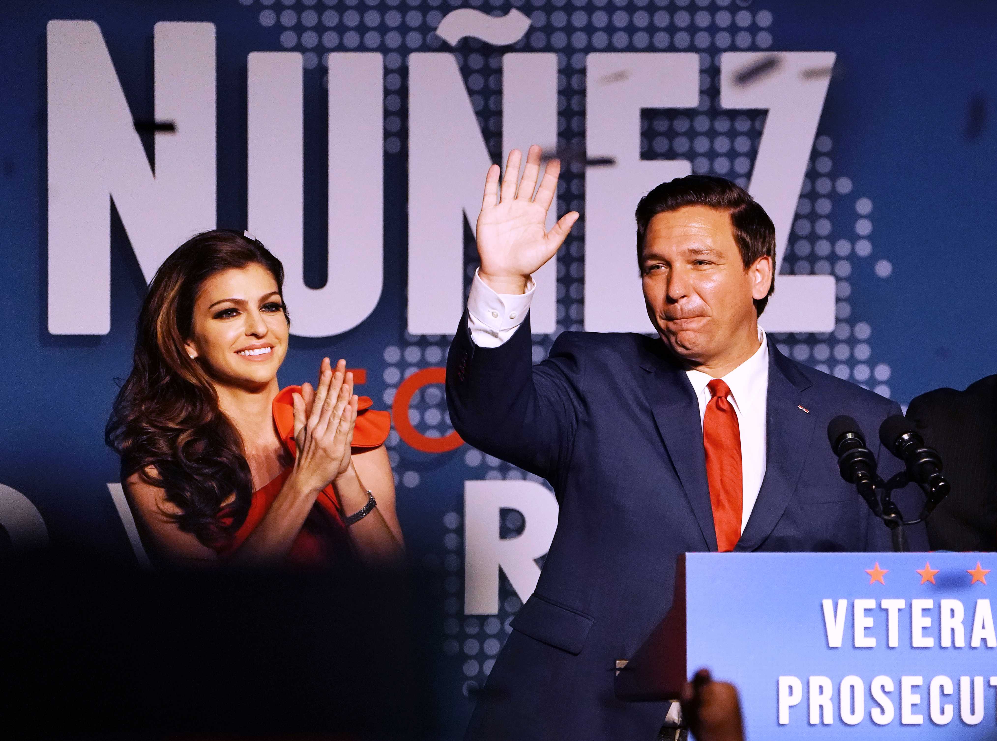 Florida Republican gubernatorial candidate Ron DeSantis speaks alongside his wife, Casey, at his midterm election night party in Orlando on Tuesday. DeSantis defeated his Democratic rival in the vote. 