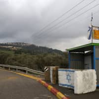 A general view shows a road leading to the Jewish West Bank settlement of Dolev, where rental properties listed on Airbnb are offered, in 2016. | REUTERS