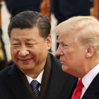 Chinese President Xi Jinping welcomes U.S. President Donald Trump at the Great Hall of the People in Beijing last November. | AP