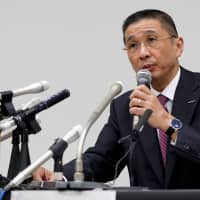 Nissan Motor Co. President and Chief Executive Officer Hiroto Saikawa speaks during a news conference Monday evening at the carmaker\'s headquarters in Yokohama after Chairman Carlos Ghosn was arrested on suspicion of underreporting his salary. | REUTERS
