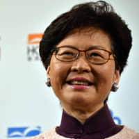 Carrie Lam, chief executive of the Hong Kong government, speaks at a symposium in Tokyo on Thursday. | YOSHIAKI MIURA
