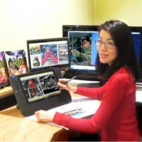Comic activism: Queenie Chan digitally draws a picture of Little Red Riding Hood at her desk in Sydney. | COURTESY OF QUEENIE CHAN
