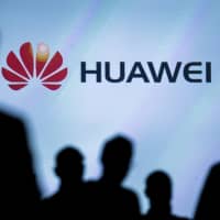 Journalists follow the presentation of a Huawei smartphone ahead of the IFA Electronics show in Berlin on Sept. 2, 2015. | REUTERS