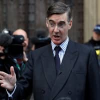 British Member of Parliament Jacob Rees-Mogg, leader of the hard-line pro-Brexit European Research Group of lawmakers, speaks from St. Stephen\'s entrance at London\'s Houses of Parliament on Thursday. | REUTERS