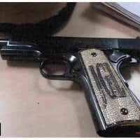 This handout photograph obtained from Brooklyn federal court shows \"El Chapo\" Guzman Loera\'s .38 Super pistol encrusted with diamonds on the handle and his initials \"JGL\", which was used as an exhibit by the government Monday by government prosecutors to the jury during Guzmaan\'s trial in Brooklyn federal court. | BROOKLYN FEDERAL COURT / VIA AFP-JIJI