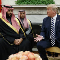 U.S. President Donald Trump meets with Saudi Crown Prince Mohammed bin Salman at the White House in March. | AP
