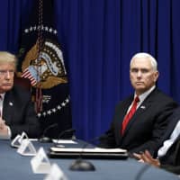 President Donald Trump speaks during a roundtable discussion on the First Step Act Monda in Gulfport, Mississippi as Vice President Mike Pence and Sen. Lindsey Graham, R-S.C. (second from right) listen. | AP