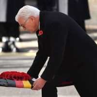 German President Frank-Walter Steinmeier lays a wreath at the Cenotaph during the Remembrance Day  ceremony in Whitehall, central London, on Sunday. | AFP-JIJI