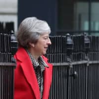 Britain\'s Prime Minister Theresa May leaves No. 10 Downing St. on Friday. | AFP-JIJI