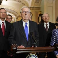 Senate Majority Leader Mitch McConnell speaks to media after a meeting in his office at the Capitol in Washington Wednesday. With McConnell are f(rom left) Sen. John Barrasso, R-Wyo., Sen. Todd Young, R-Ind., Sen. Roy Blunt, R-Mo., Sen. Chuck Grassley, R-Iowa, and Sen. Joni Ernst, R-Iowa (right). | AP