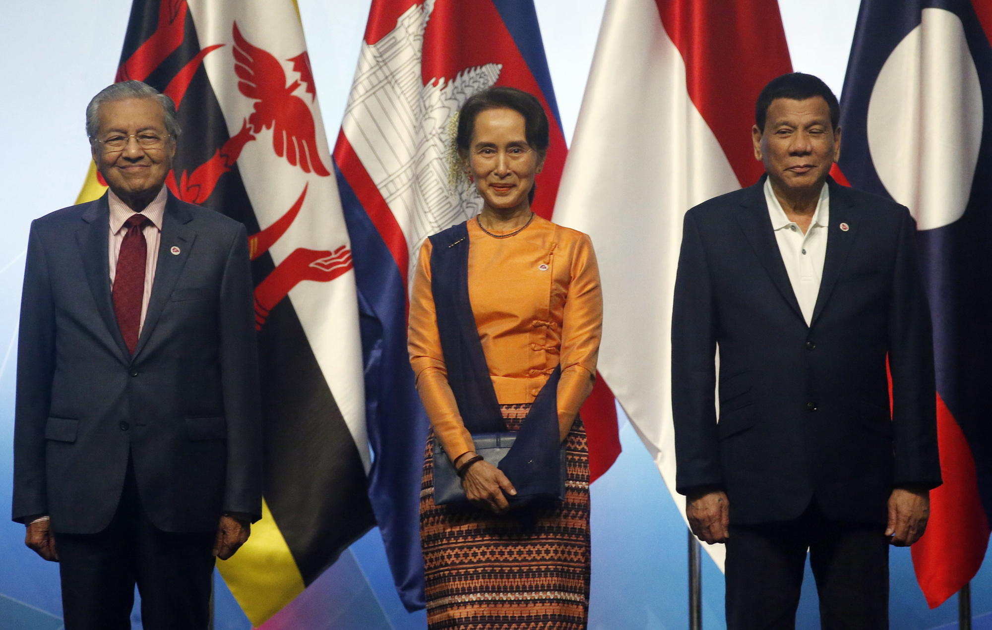 Malaysian Prime Minister Mahathir Mohamad, Myanmar leader Aung San Suu Kyi and Philippine President Rodrigo Duterte pose for a photo at the ASEAN summit on Tuesday. | AP