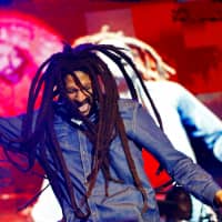 Julian Marley, son of the late reggae icon Bob Marley, performs at a concert celebrating his father\'s 69th birthday at the National Stadium in Kingston in 2014. | REUTERS