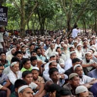 Rohingya refugees take part in a protest at the Kutupalong refugee camp to mark the one year anniversary of their exodus, in Cox\'s Bazar, Bangladesh, in August. | REUTERS