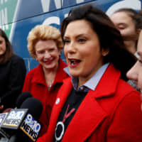 Michigan Democratic gubernatorial candidate Gretchen Whitmer talks to reporters as she arrives to vote at her polling station at the St. Paul Lutheran Church in East Lansing, Michigan, on Tuesday. Whitmer was later declared winner in the race. | REUTERS