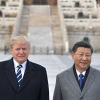 U..S President Donald Trump (left) and Chinese President Xi Jinping pose at the Forbidden City in Beijing last November. There is a \"good possibility\" Trump will reach an agreement later this week to resolve the U..S trade dispute with China, a White House official said Tuesday. | AFP-JIJI