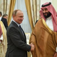 Russia President Vladimir Putin shakes hands with Saudi Crown Prince Mohammed bin Salman during their meeting in Moscow in June. Prince Mohammed is expected to hold bilateral talks with Putin at the G20 in Buenos Aires, but not meet with Donald Trump. | AP