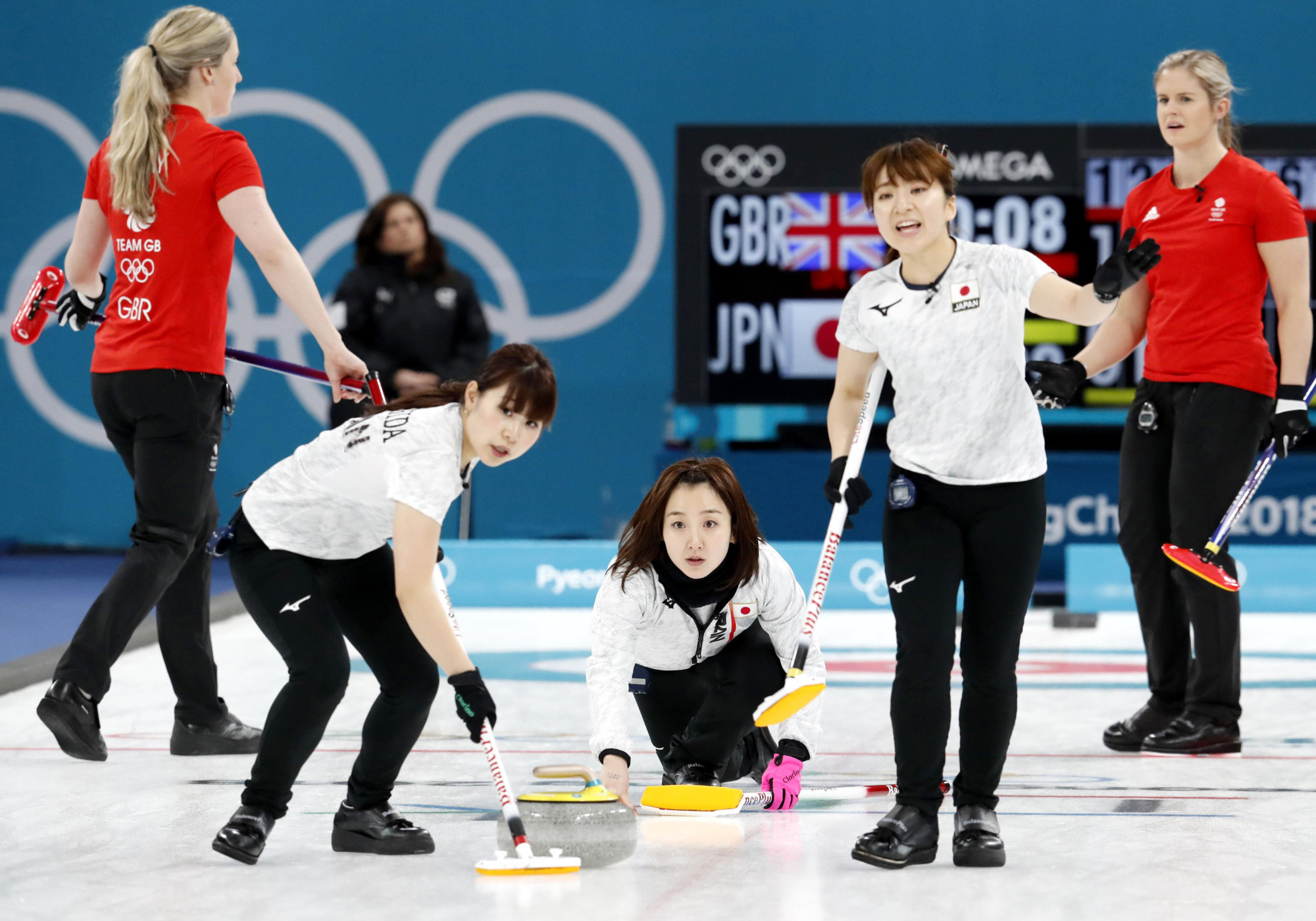 The Japanese women's curling team plays against Great Britain in the Pyeongchang Olympics in Gangneung, South Korea, where they won the bronze medal. | KYODO