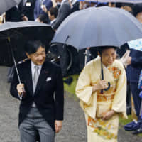 Crown Prince Naruhito and Crown Princess Masako attend an Imperial garden party at the Akasaka Imperial Gardens in Tokyo on Friday. | KYODO