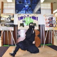 Visitors can get a virtual-reality ninja experience at a booth set up in the international arrivals lobby at Chubu Centrair International Airport in Aichi Prefecture. | KYODO