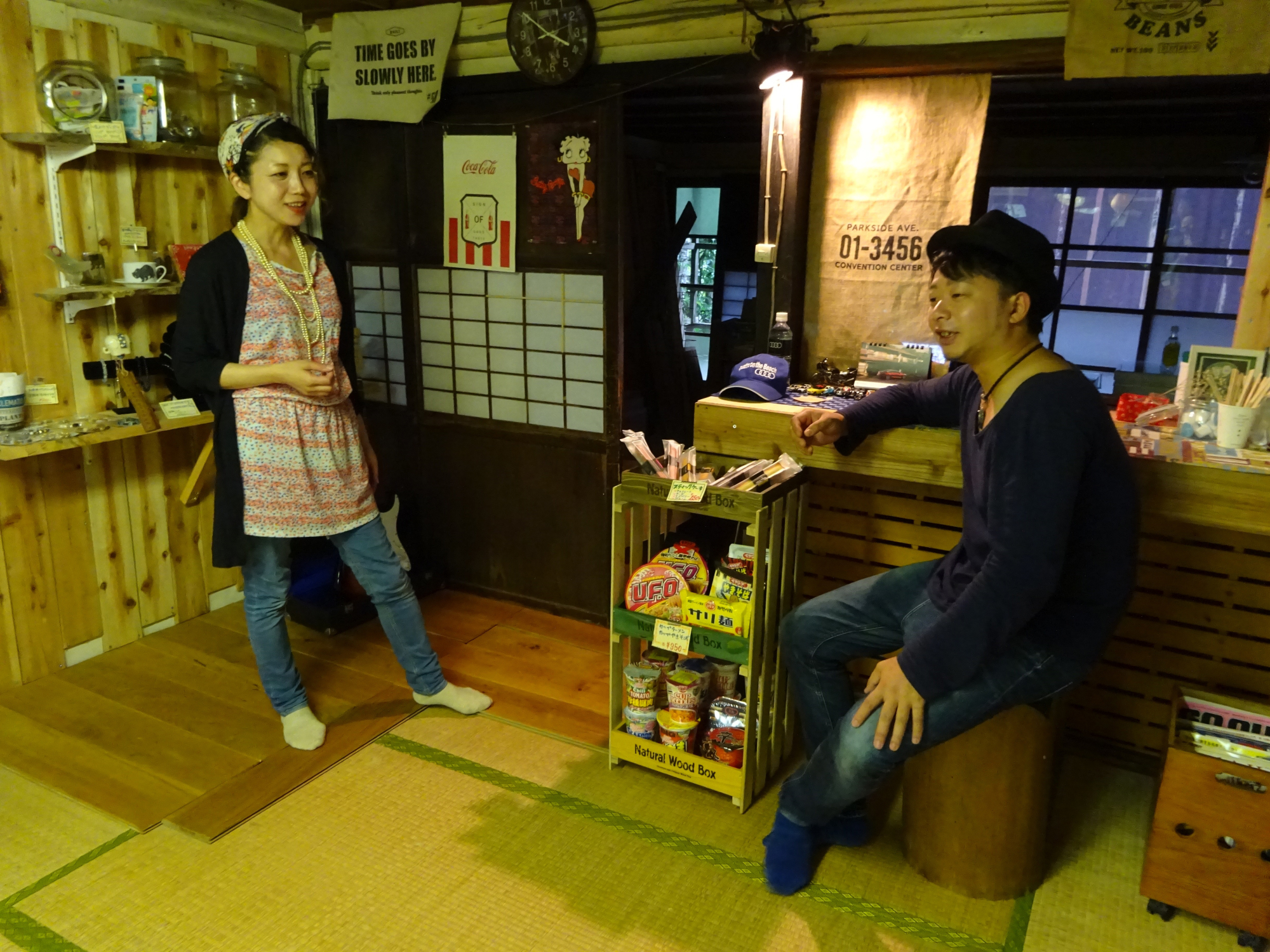 Naoko Ida and her husband, Takayuki, who have lived in the western Tokyo town of Okutama for several years, explain the features of the teahouse they opened last year during an interview in September. | SARAH SUK
