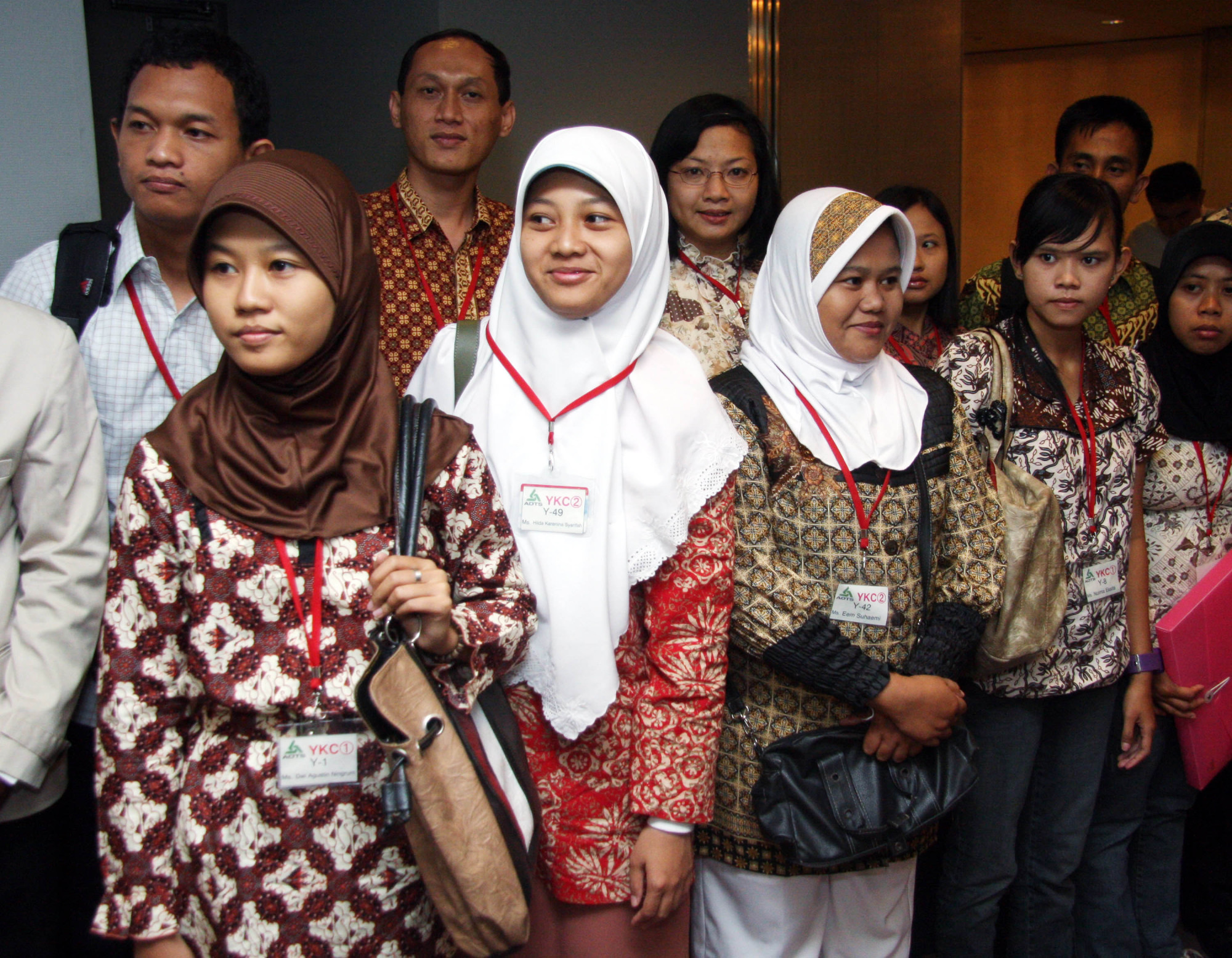 Indonesian nursing interns arrive at an opening ceremony for a Japanese school in Tokyo in August 2008. A survey published Tuesday has revealed that 59 percent of the public think immigrants make the country stronger because of their work and talents. | BLOOMBERG