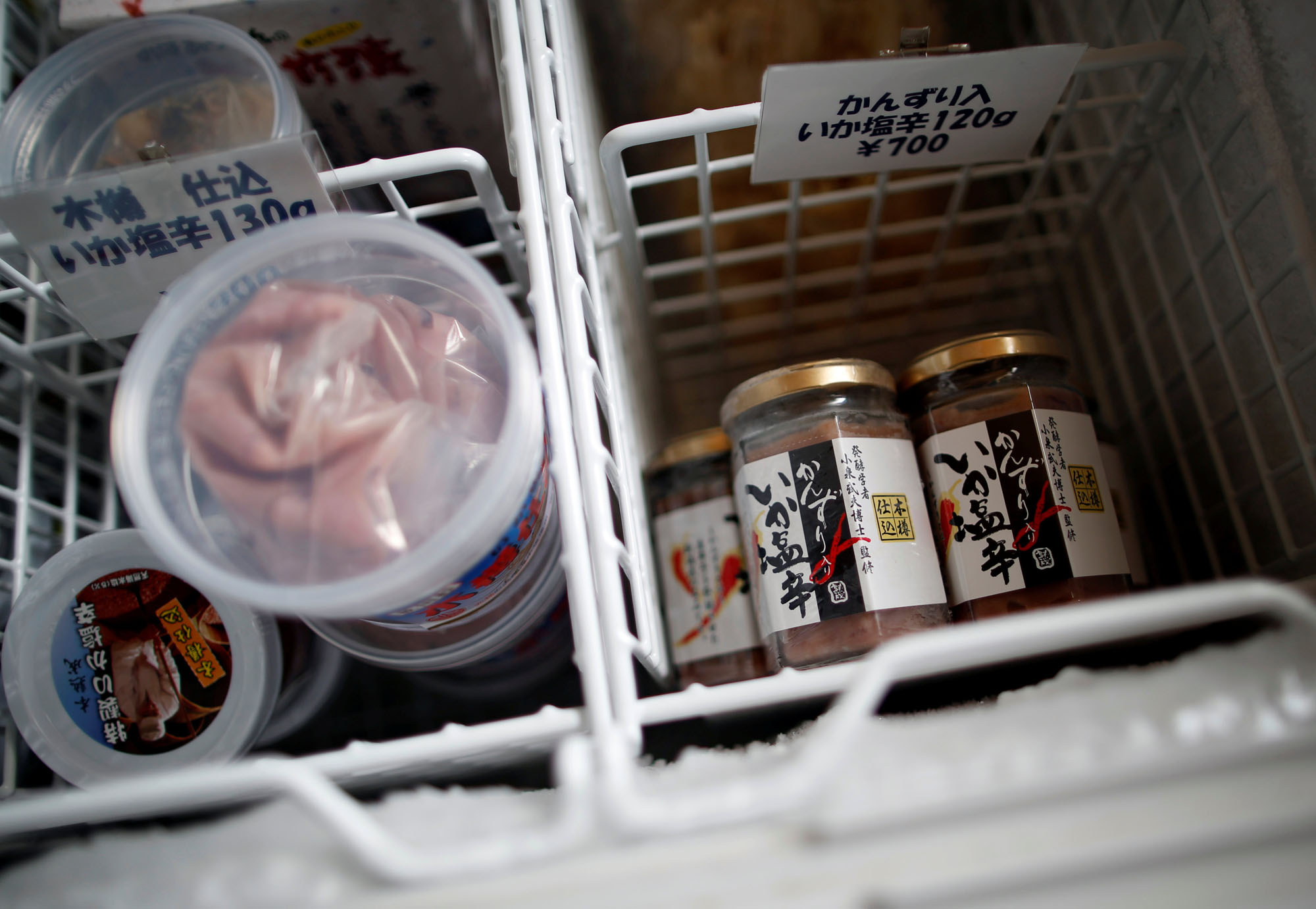 Shiokara products, made from a traditional fermented squid dish, are pictured inside a freezer at a factory owned by Takashi Odajima in Hakodate, Hokkaido, on July 19.