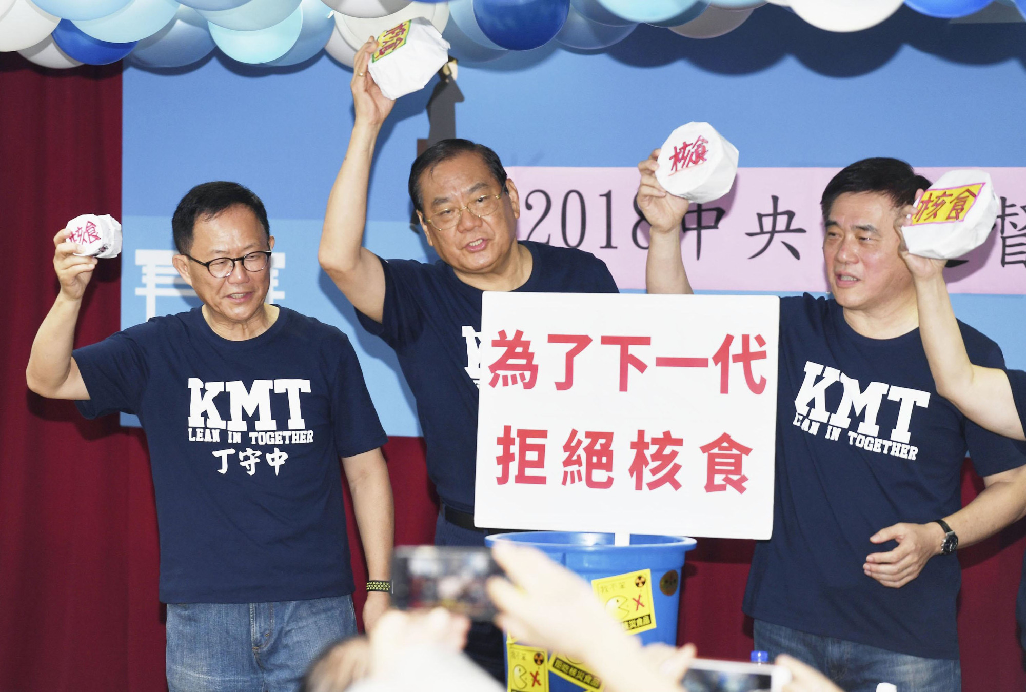 Taiwanese Nationalist Party executives call for the continuation of a ban on food imports from five Japanese prefectures, in Taipei in July. | CNA / VIA KYODO