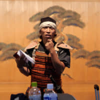 Tomoya Takano (left) and Hajime Takano attend a discussion session held in the Kamakura Nohbutai theater during the Kamakura tour on Oct. 14. | CHISATO TANAKA