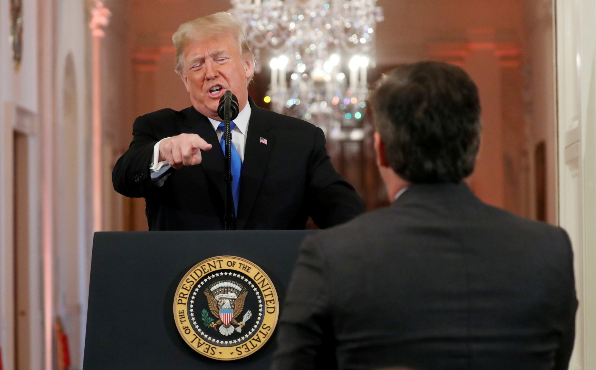 U.S. President Donald Trump points at CNN's Jim Acosta and accuses him of 'fake news' during a news conference at the White House on Wednesday. | REUTERS
