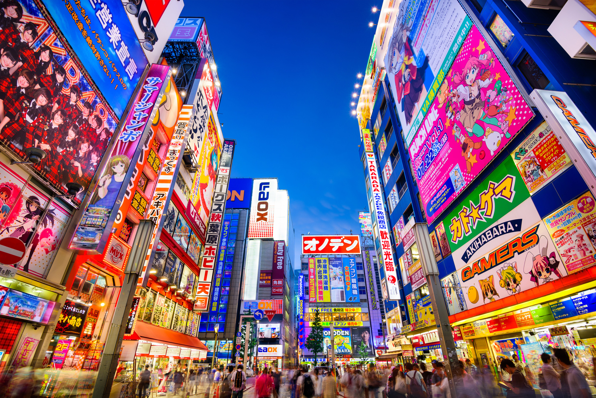 Colorful capital: Crowds pass below signs in Tokyo's Akihabara district. | GETTY IMAGES