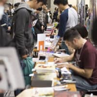 New markets: Manga creators interact with fans at last year\'s Tokyo International Comic Festival. The event aims to help non-Japanese artists make connections with fans in Japan. | COURTESY OF TOKYO INTERNATIONAL COMIC FESTIVAL