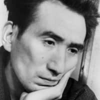 Humanity lost: A photograph of Osamu Dazai, taken in February 1948, the year he published \"Ningen Shikkaku,\" and just four months before his death by suicide. | SHIGERU TAMURA