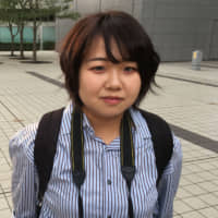 Koshiba Ranko, 22, Student (Japanese): My commuting time is around 30 minutes. During that time, I\'m basically just looking at Twitter. | GETTY IMAGES