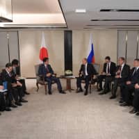 Meeting in Singapore on Nov. 14, Prime Minister Shinzo Abe and Russian President Vladimir Putin agreed to speed up talks on a peace treaty their two countries negotiated after World War II but the Soviet Union refused to sign. | AFP-JIJI