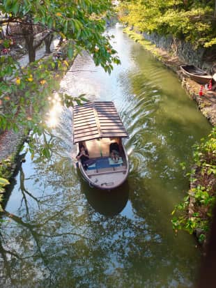 Boating to the biennale: A small boat sits in one of Omihachiman