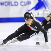 Kazuki Yoshinaga finishes first in the men\'s 1,500-meter final at the short track World Cup in Calgary, Alberta on Saturday. | KYODO