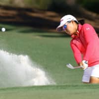 Nasa Hataoka plays a shot out of a bunker during the third round of the CME Group Tour Championship on Saturday in Naples, Florida. | KYODO