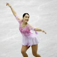Mai Mihara, seen performing to \"Romance on the High Seas,\" sits in third place after the women\'s short program at the NHK Trophy on Friday in Hiroshima. | KYODO