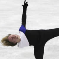 Sergei Voronov is in second place with 91.37 points after Friday\'s short program. | AP
