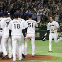 Samurai Japan\'s Yuki Yanagita heads home after blasting a two-run walk-off home run in the ninth inning off MLB All-Stars closer Kirby Yates on Friday at Tokyo Dome. Japan won 7-6. | AP
