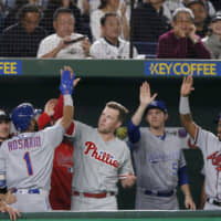 MLB All-Stars shortstop Amed Rosario celebrates with teammates after sitting a solo home run in the third inning. | AP